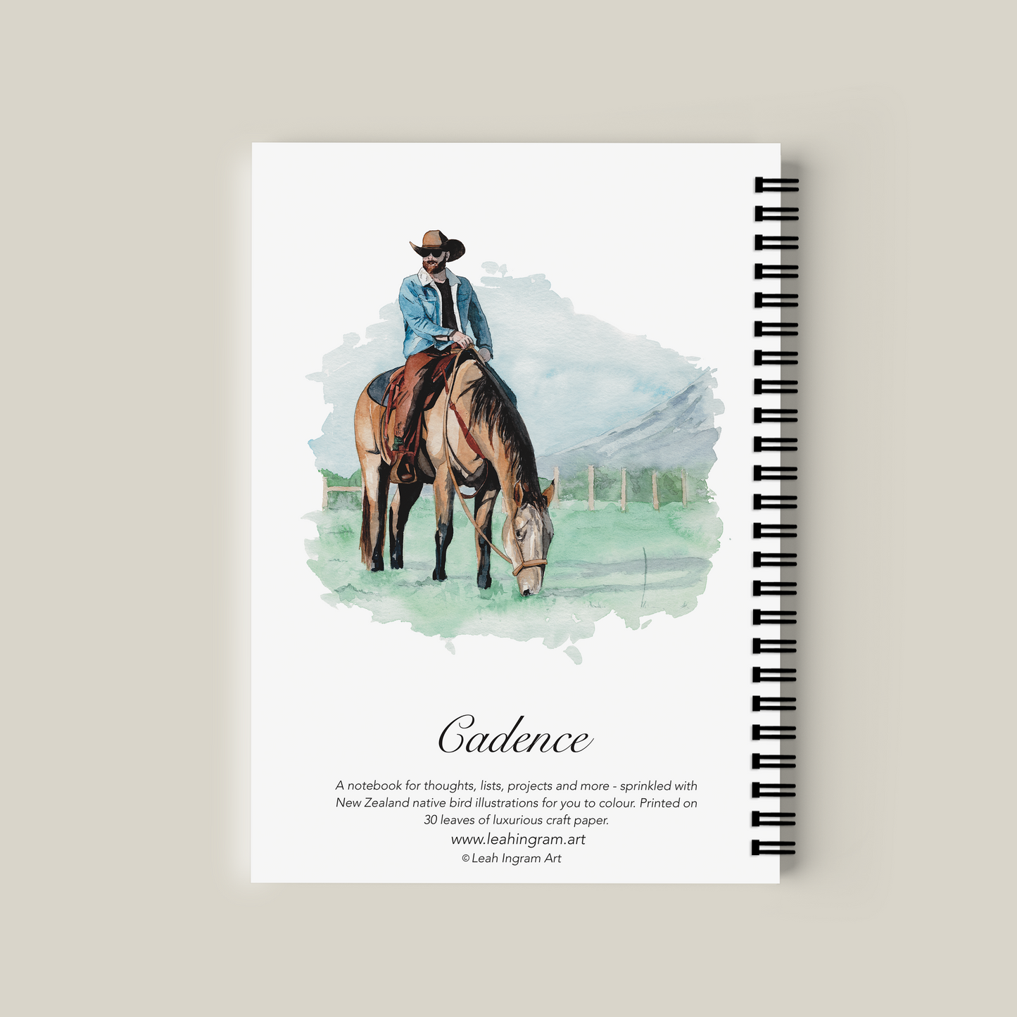 Notebook with a cover illustration of a person on a horse, titled 'Cadence'.