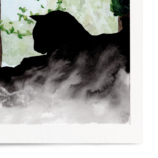 Framed artwork of a silhouette of a cat by a window with greenery