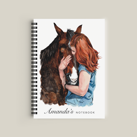 Notebook with illustration of a girl and horse on the cover, titled 'Amanda's Notebook'.