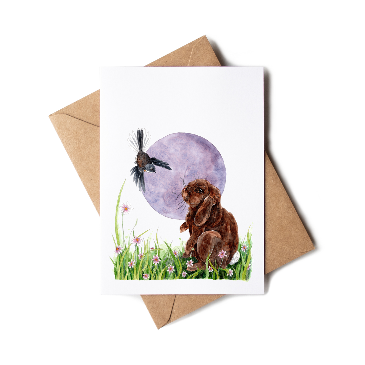Greeting card with a rabbit and bird illustration on a white background