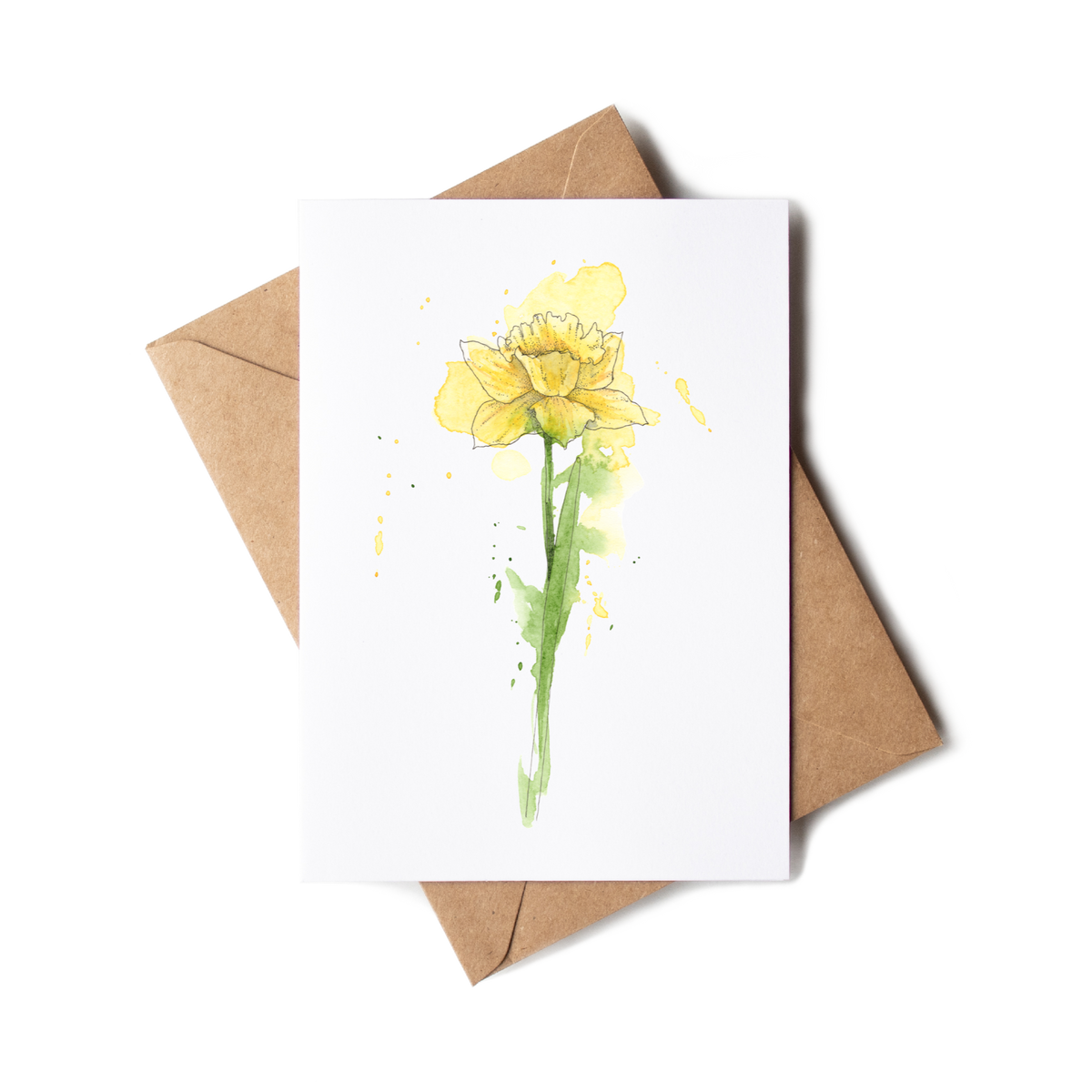 Greeting card with yellow flower design and brown envelope on white background