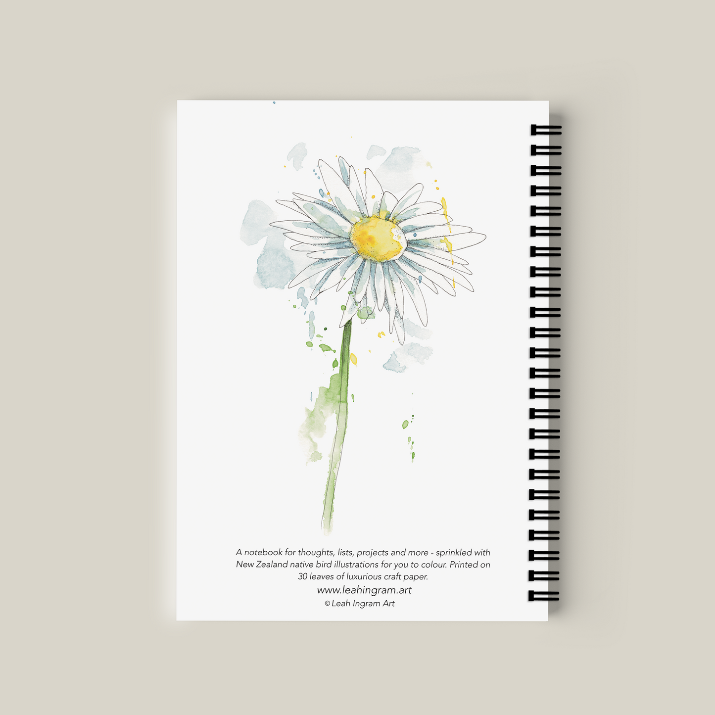 Notebook with a daisy illustration on a beige background