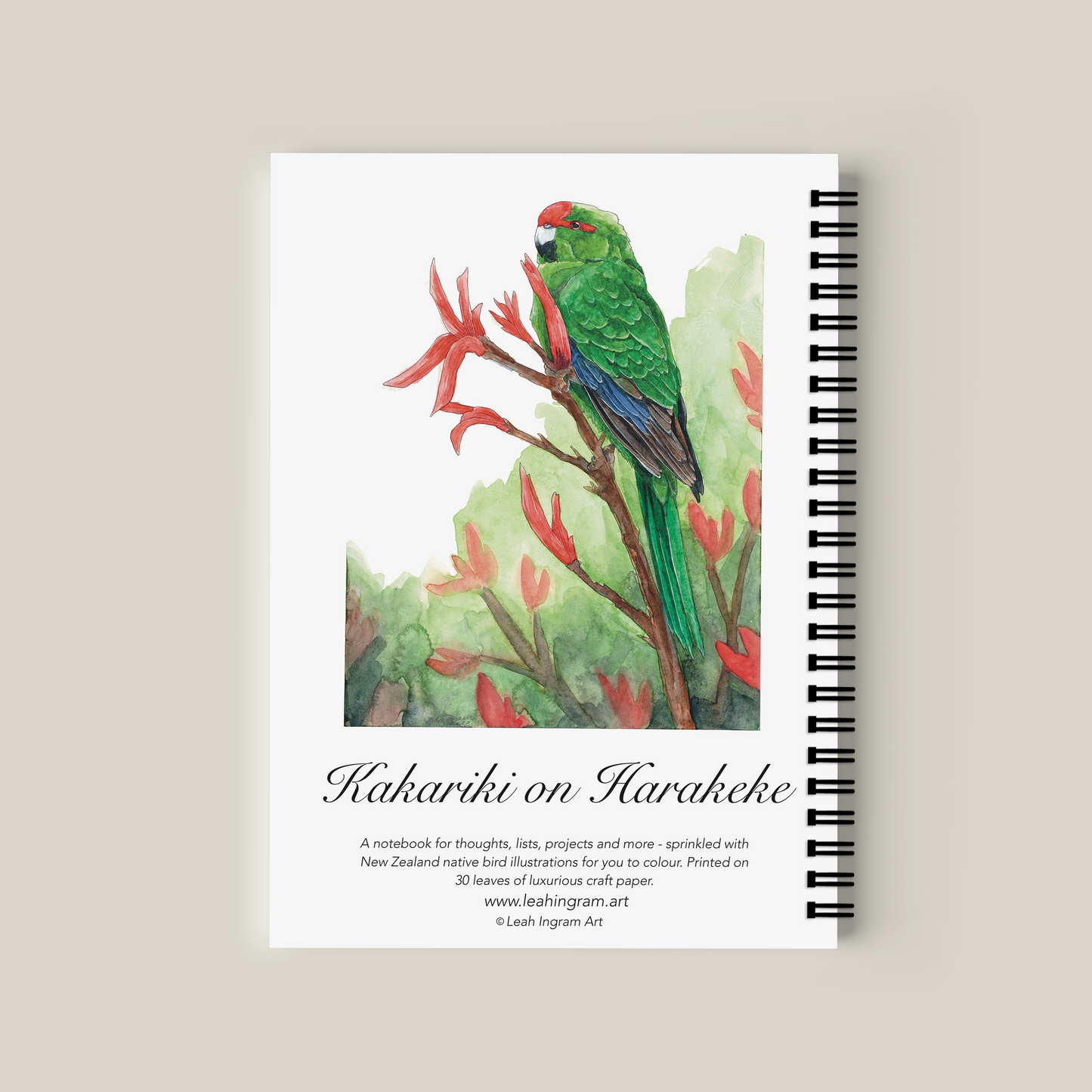 Notebook with a green parrot illustration on a beige background