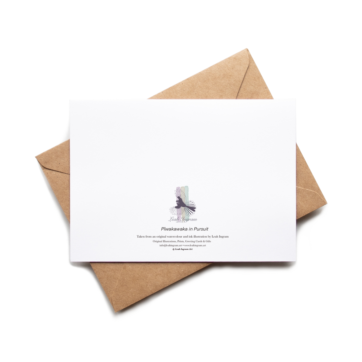 White card with a purple graphic and text on a brown envelope against a white background