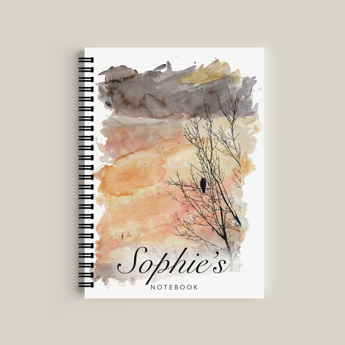 Notebook with watercolor design and 'Sophie's Notebook' text on a beige background