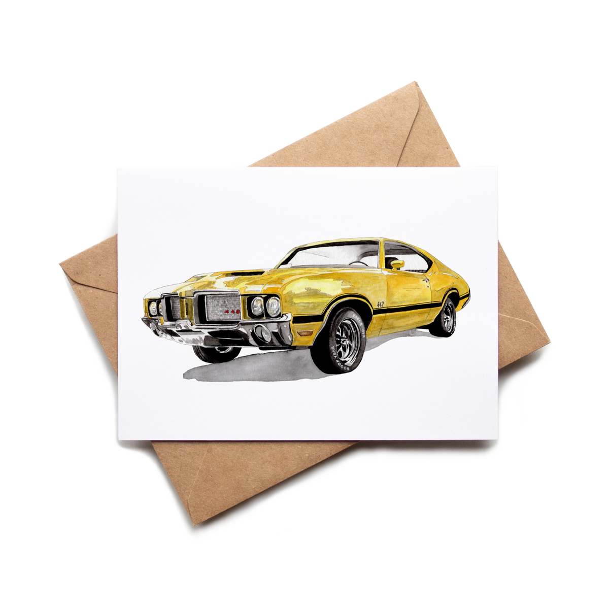 Card with a yellow muscle car illustration on a white background with a brown envelope.