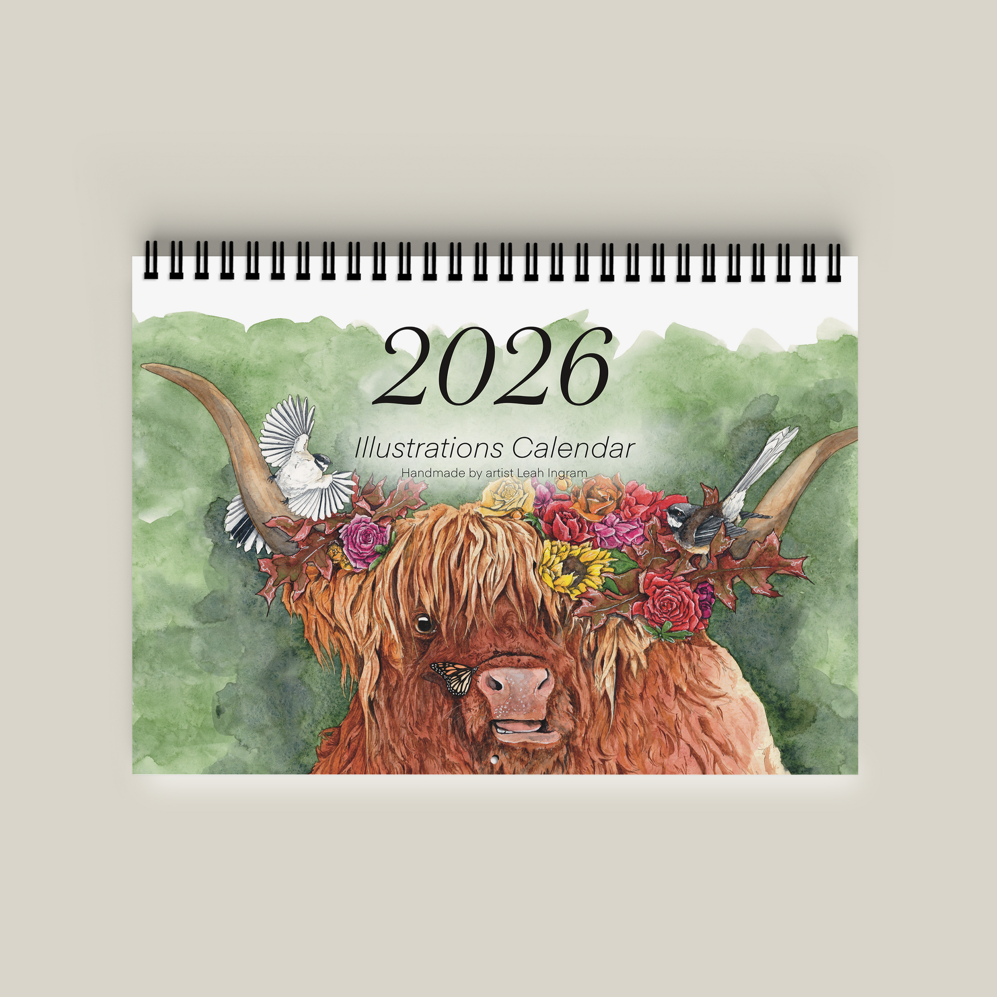 2026 calendar with a highland cow illustration on a beige background