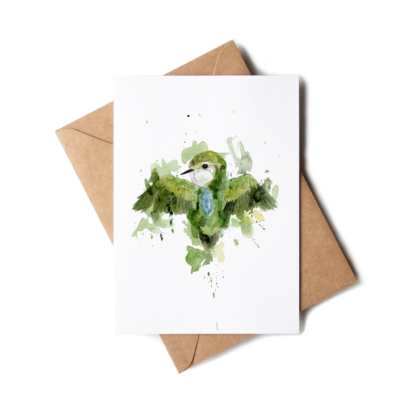 Greeting card with a green bird illustration on a white background, accompanied by a brown envelope.