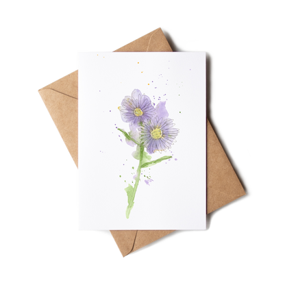 Greeting card with purple flower illustration and brown envelope on white background