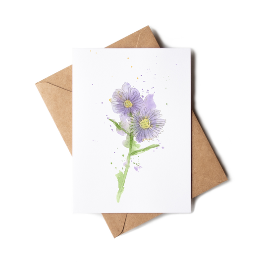 Greeting card with purple flower illustration and brown envelope on white background