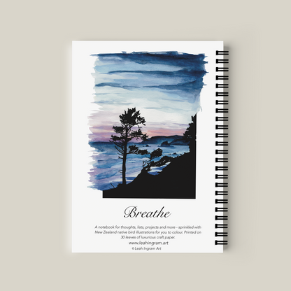 Notebook with a scenic cover design on a beige background