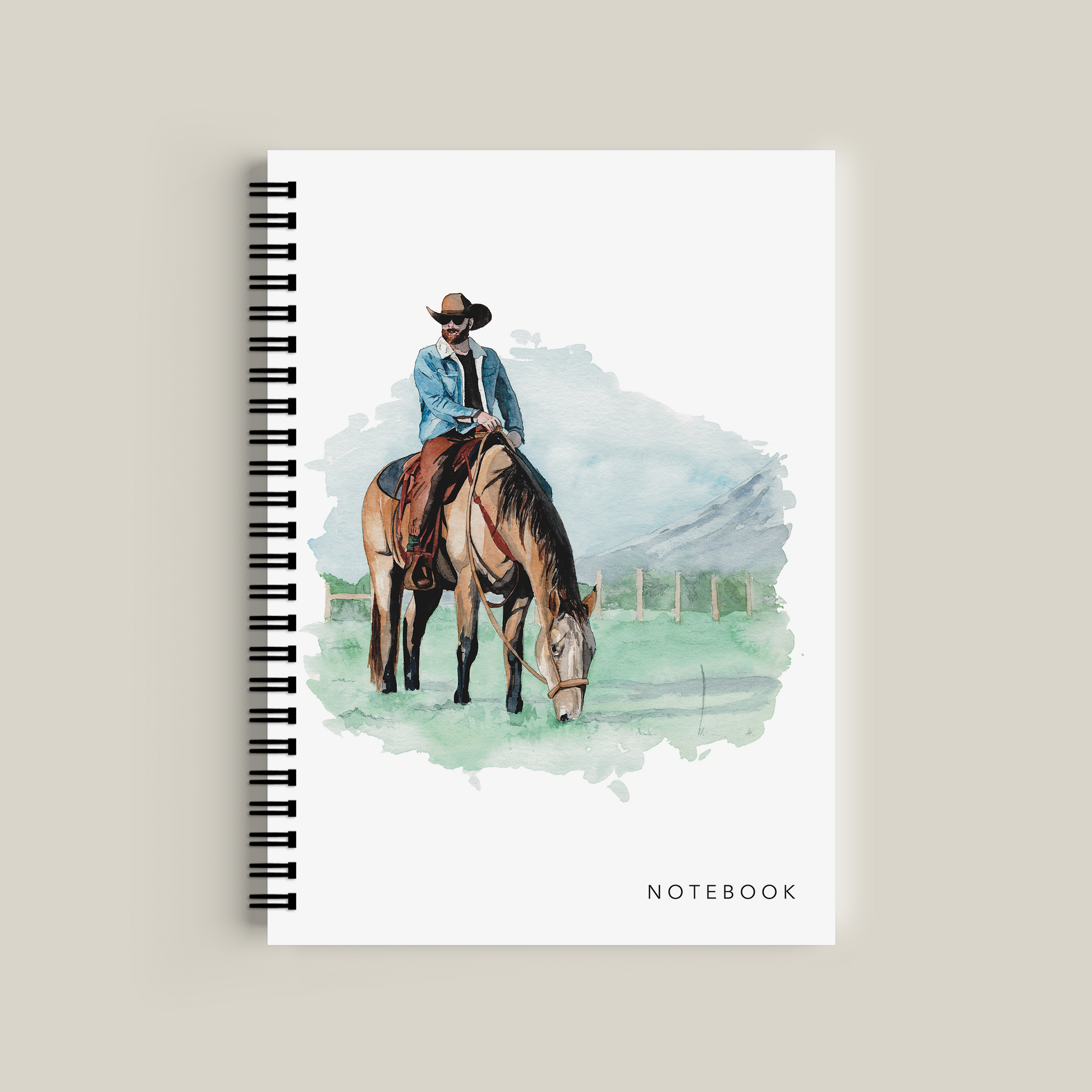 Notebook with a cover illustration of a person on a horse, on a beige background