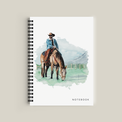 Notebook with a cover illustration of a person on a horse, on a beige background