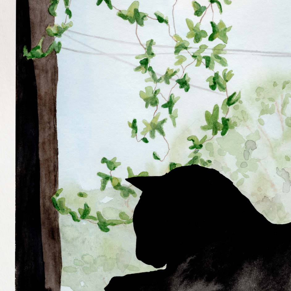 Framed artwork of a silhouette of a cat by a window with greenery