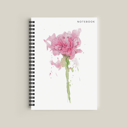 Notebook with a pink flower design on a beige background