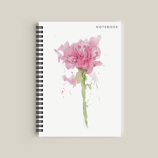 Notebook with a pink flower design on a beige background