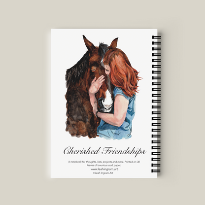 Notebook with a design of a woman hugging a horse on a beige background