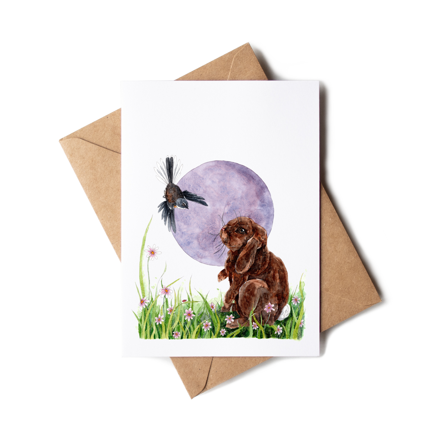 Greeting card with a rabbit and bird illustration on a white background