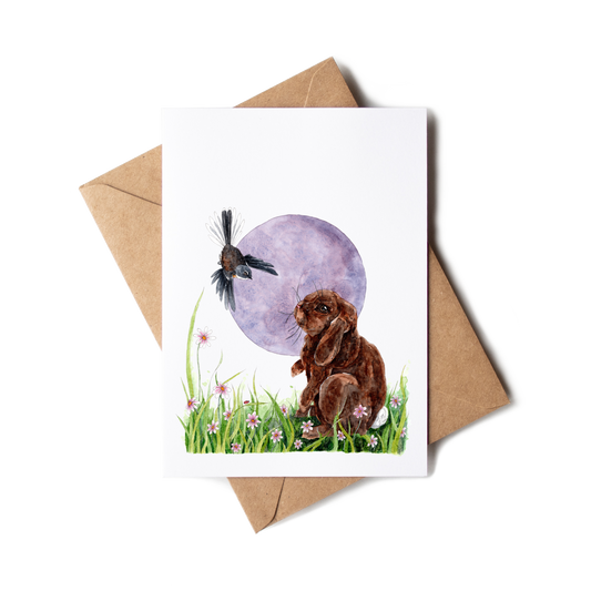 Greeting card with a rabbit and bird illustration on a white background