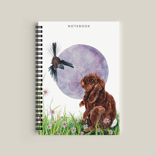 Notebook with a design of a dog and butterfly on a white background