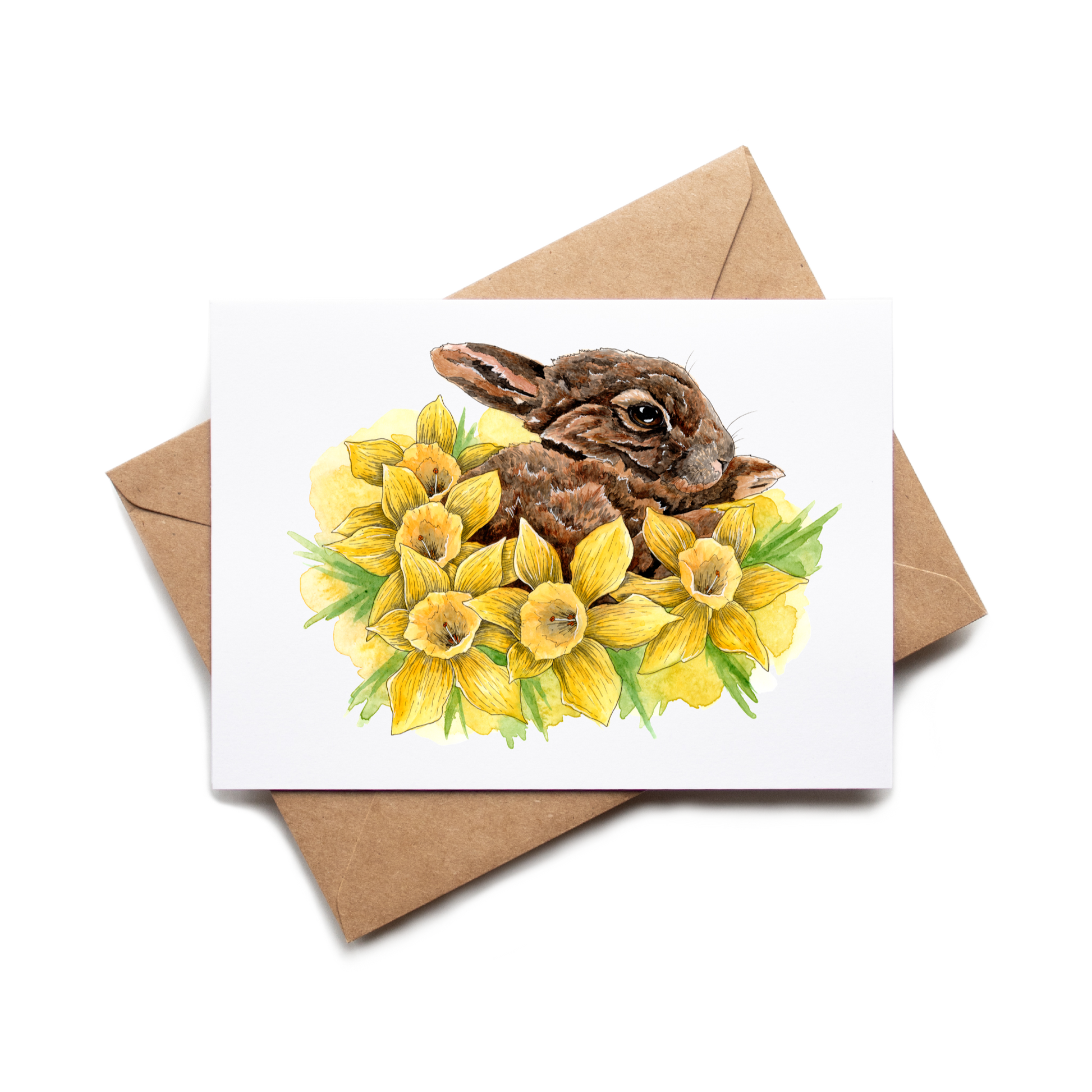 Card with a rabbit and daffodils on a white background