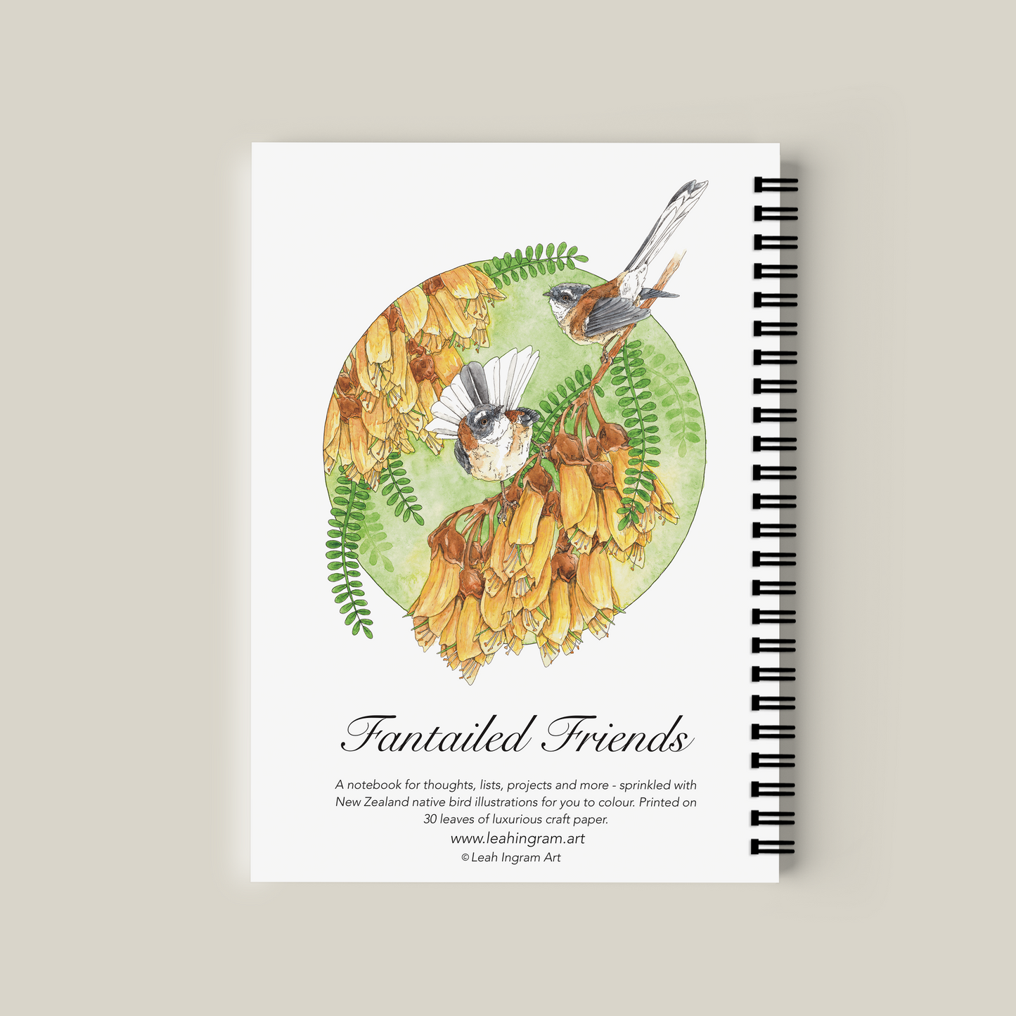 Notebook with bird illustration on a beige background