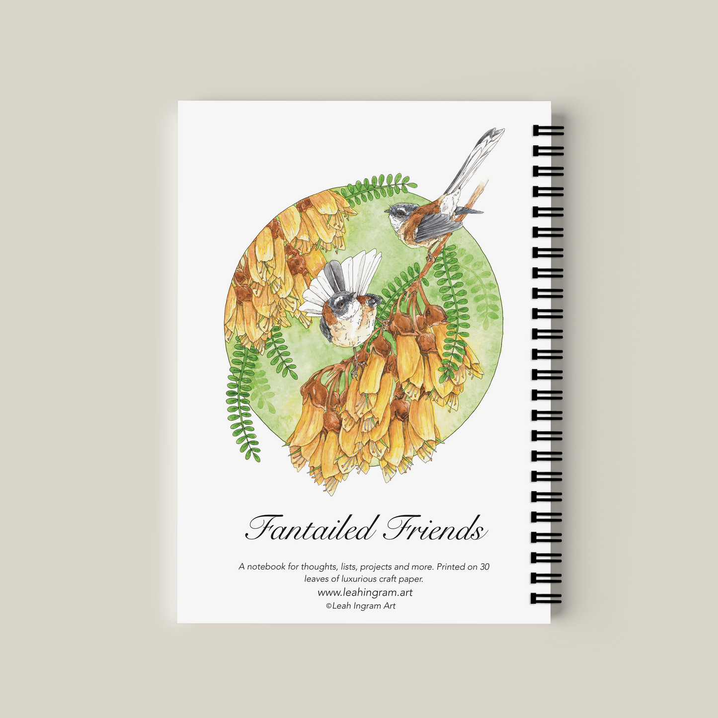 Notebook with bird illustration on a beige background