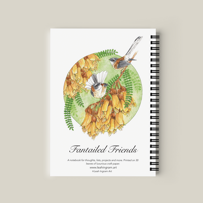 Notebook with bird illustration on a beige background