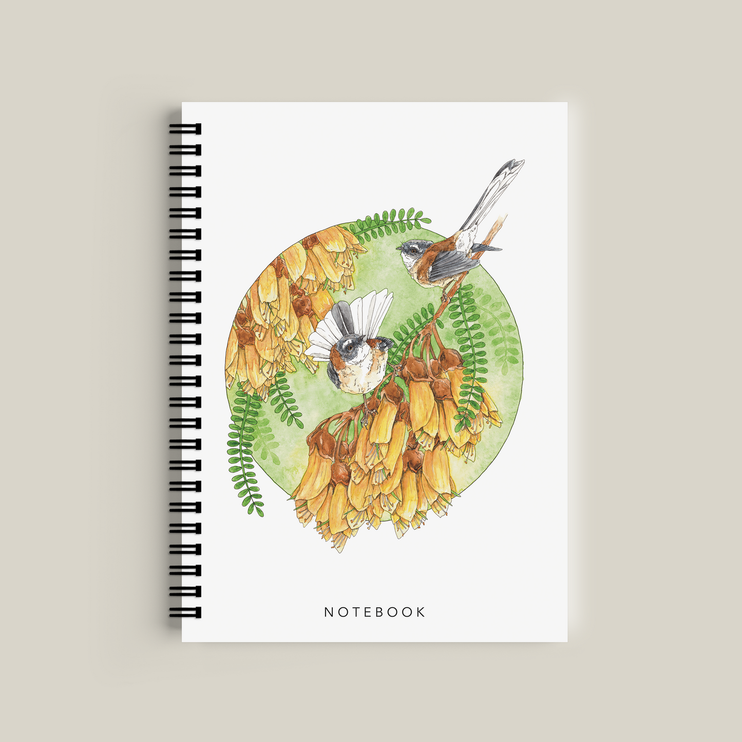 Notebook with a colorful design of birds and flowers on a beige background