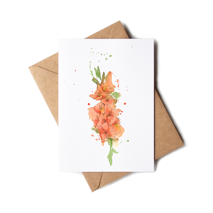 Greeting card with floral design and brown envelope on white background