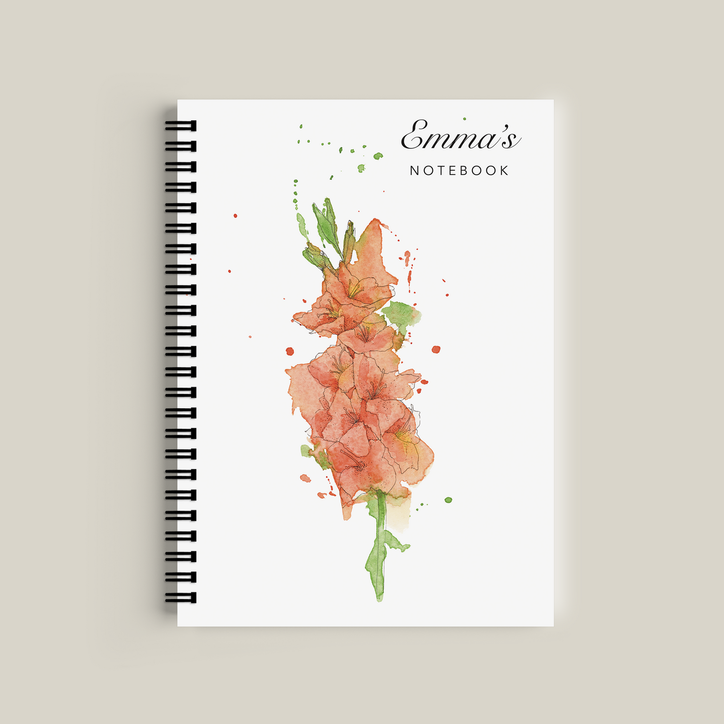 Notebook with floral design and 'Emma's Notebook' text on a beige background