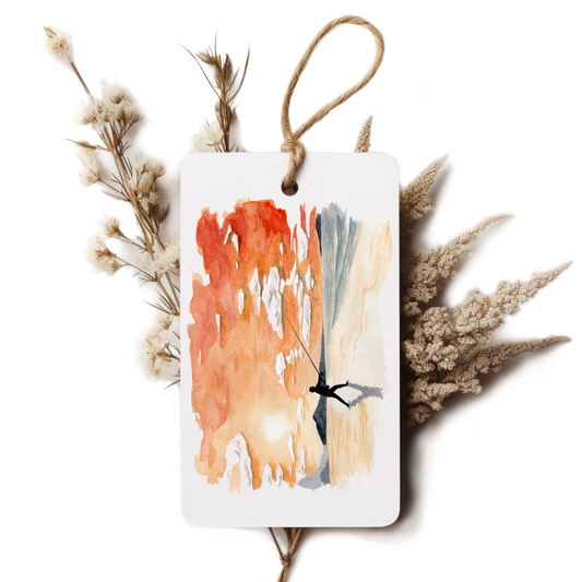 Decorative tag with abstract art and dried plants on a white background