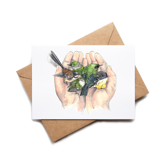 Card with illustration of hands holding birds on a white background with a brown envelope.