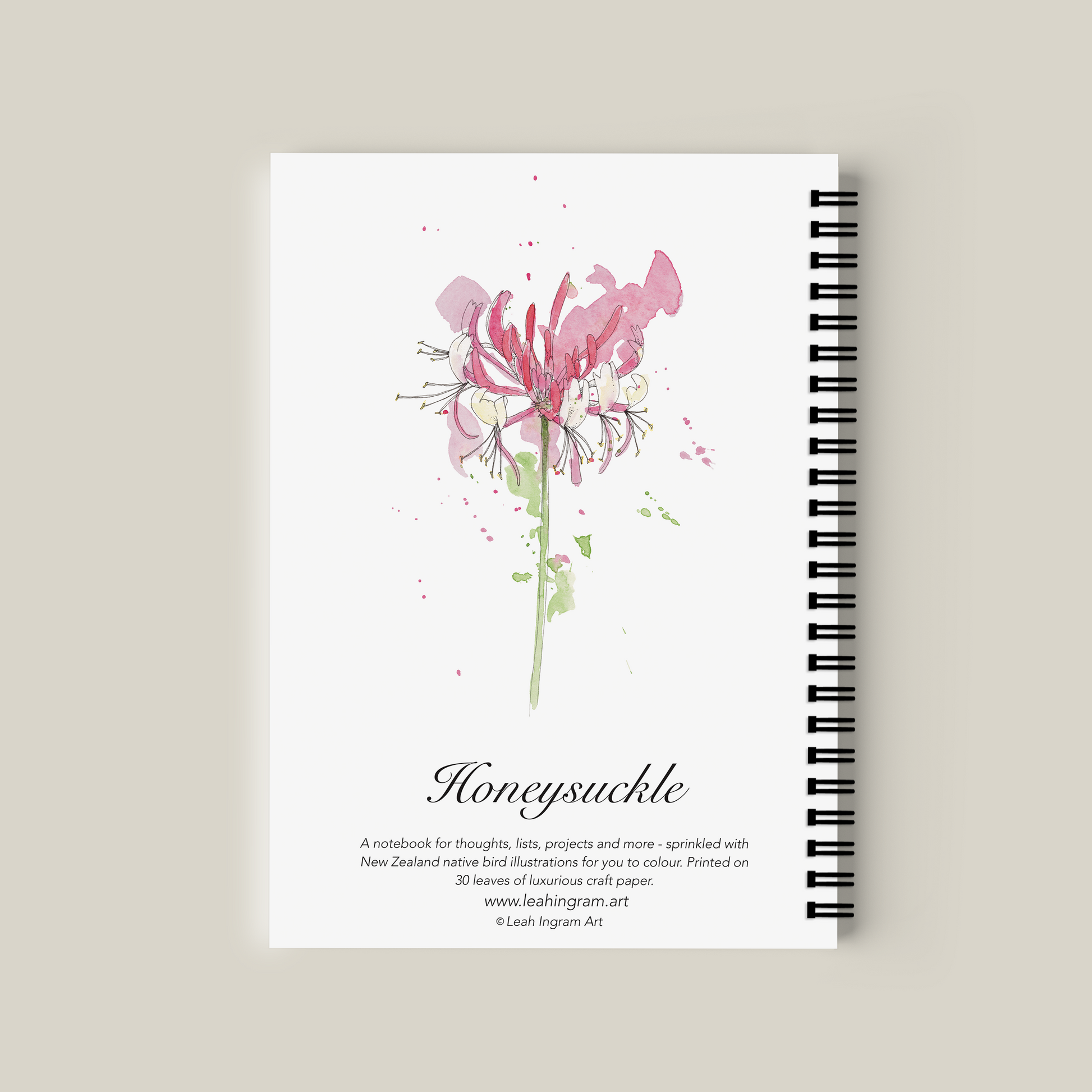 Notebook with a pink flower illustration on a beige background