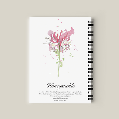 Notebook with a pink flower illustration on a beige background