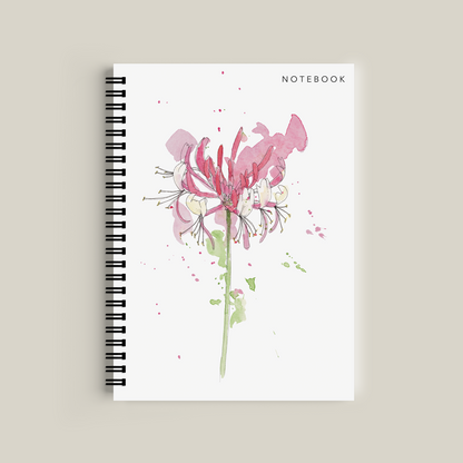 Notebook with floral design on a beige background