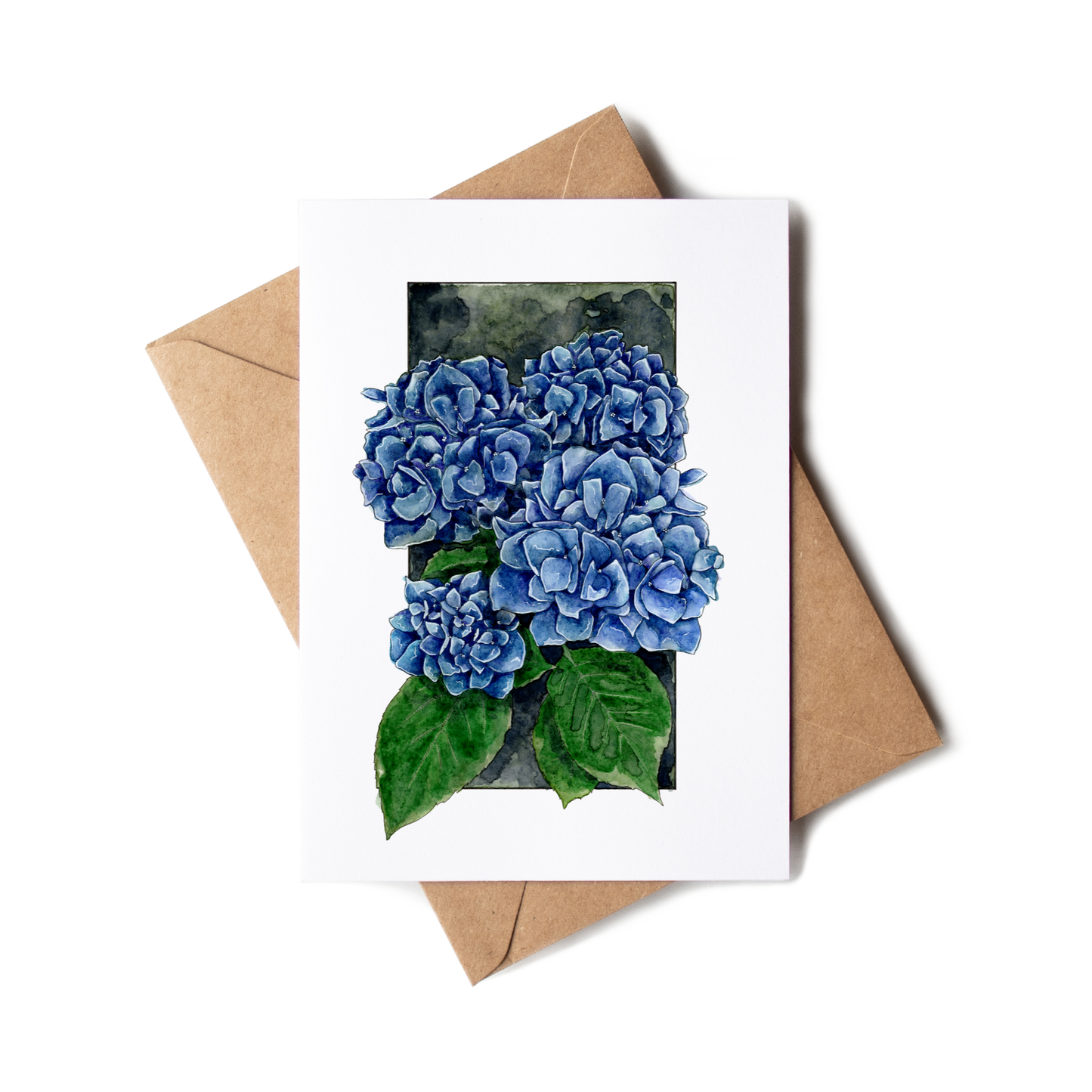 Greeting card with blue hydrangea flowers and a brown envelope on a white background