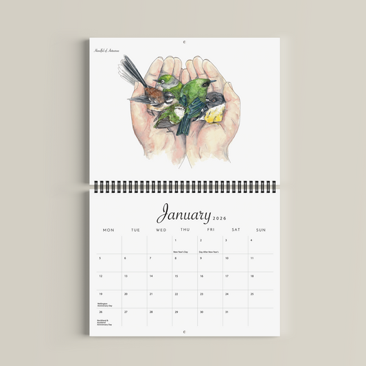 Calendar with illustration of hands holding birds on a beige background