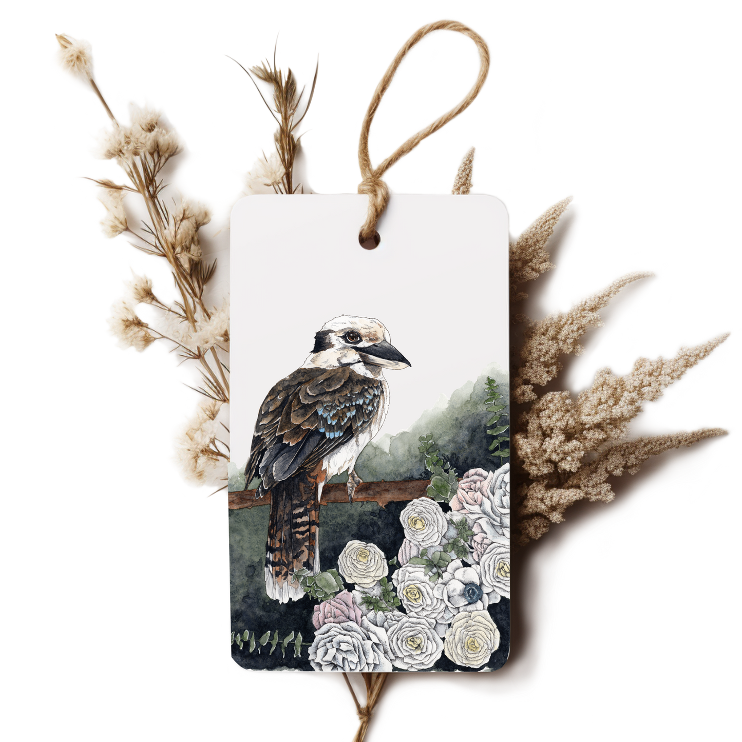 Decorative tag with a bird illustration surrounded by flowers and dried plants on a white background