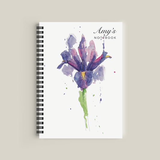 Notebook with floral design and 'Amy's Notebook' text on a beige background
