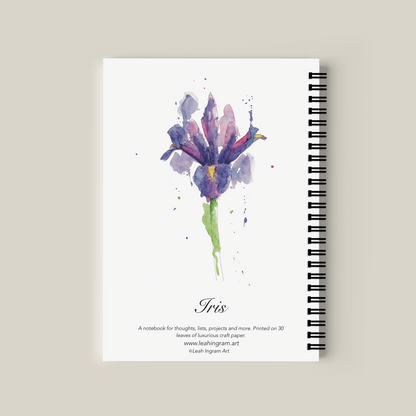 Notebook with watercolor iris design on a beige background