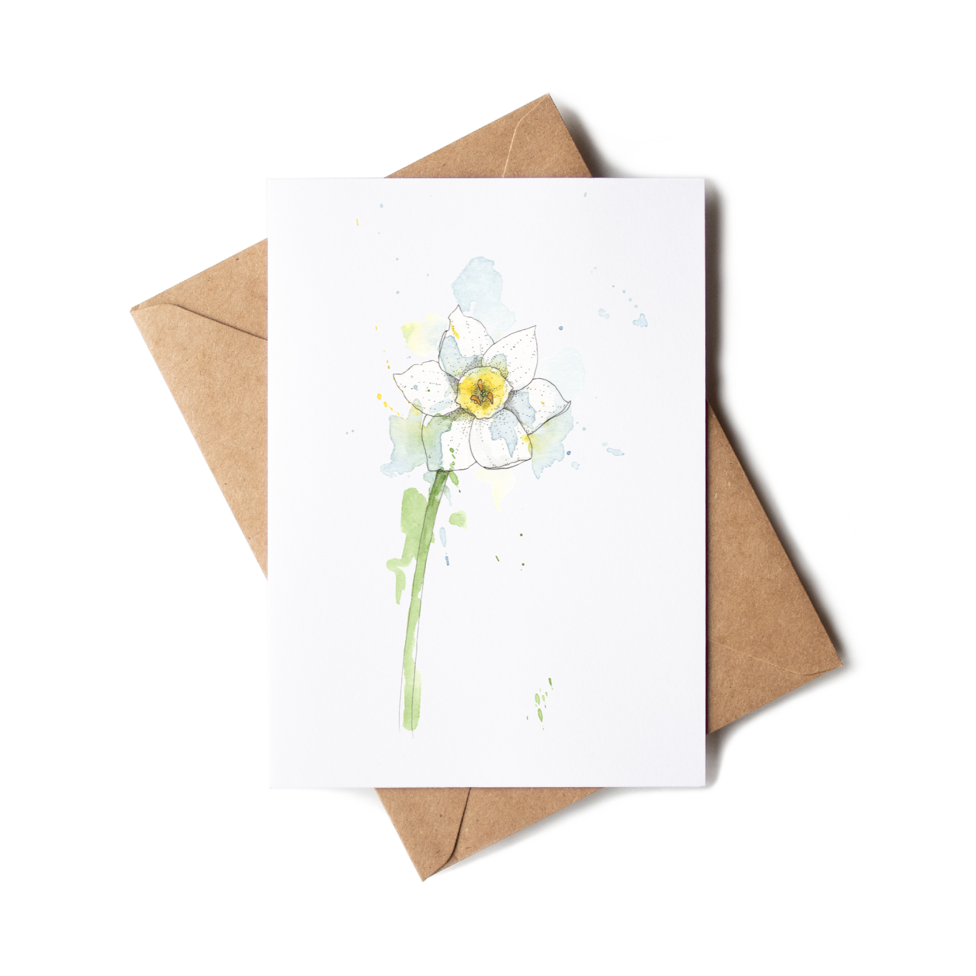 Greeting card with a daffodil illustration on a white background with a brown envelope.