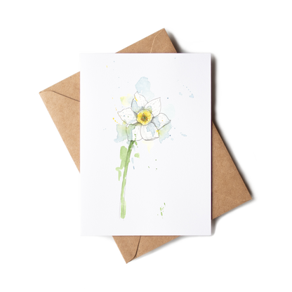 Greeting card with a daffodil illustration on a white background with a brown envelope.