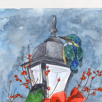 Framed artwork of two birds perched on a lamp post with a red bow, against a blue watercolor background.