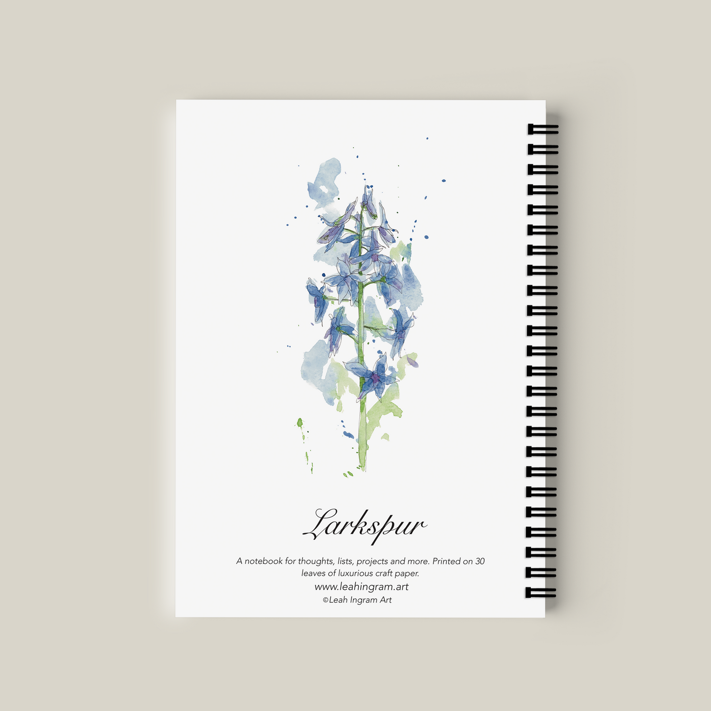 Notebook with floral design on a beige background