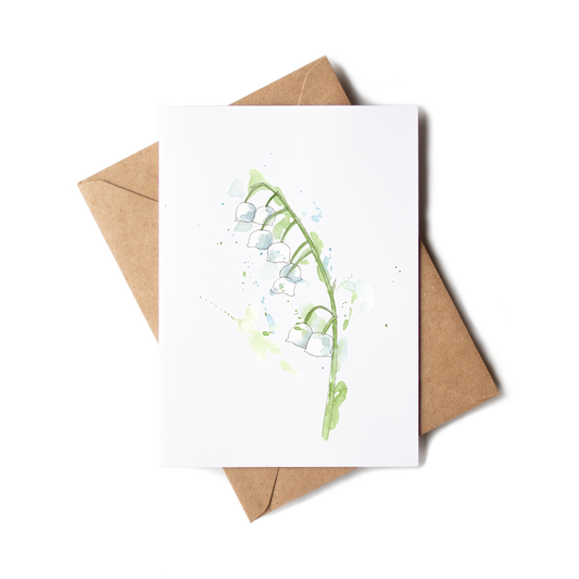 Greeting card with floral design and brown envelope on white background