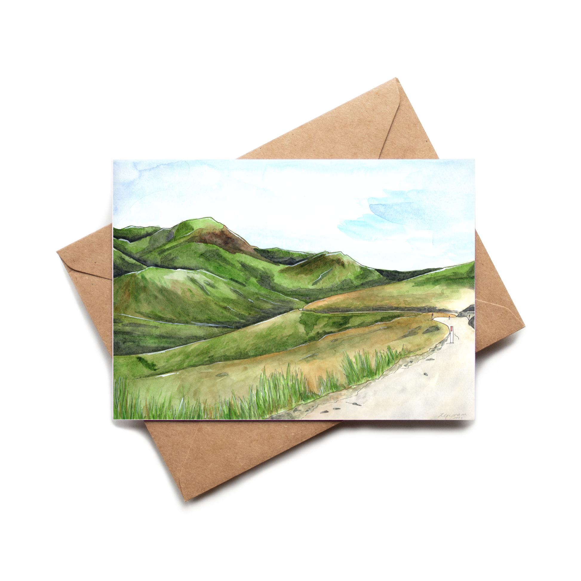 Greeting card with a landscape illustration on a brown envelope