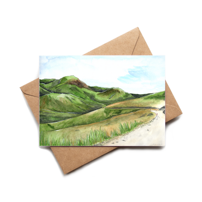Greeting card with a landscape illustration on a brown envelope
