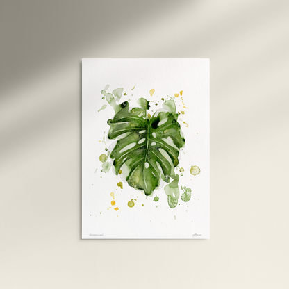 Framed artwork of green leaves on a white background