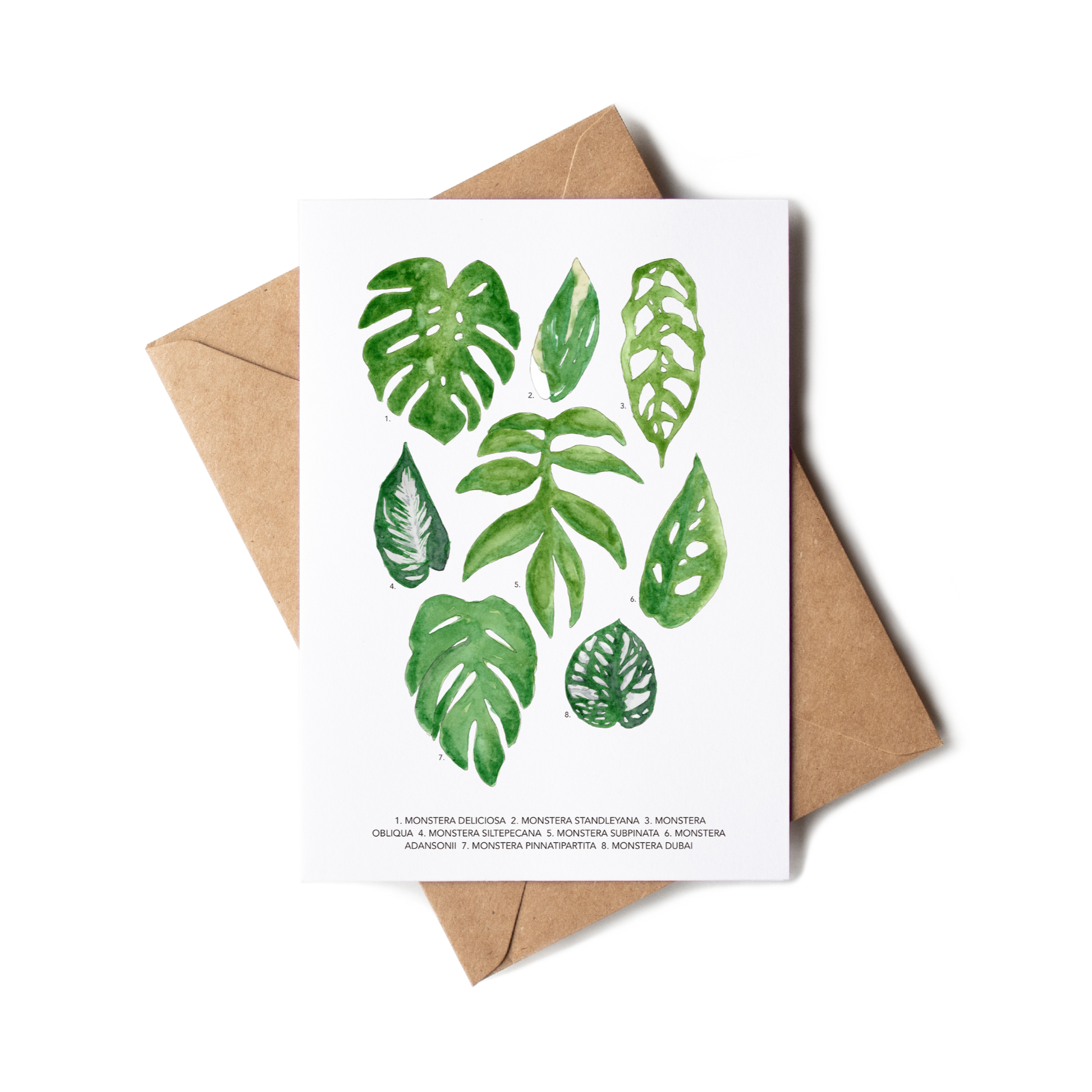 Greeting card with green leaf illustrations on a white background, accompanied by a brown envelope.